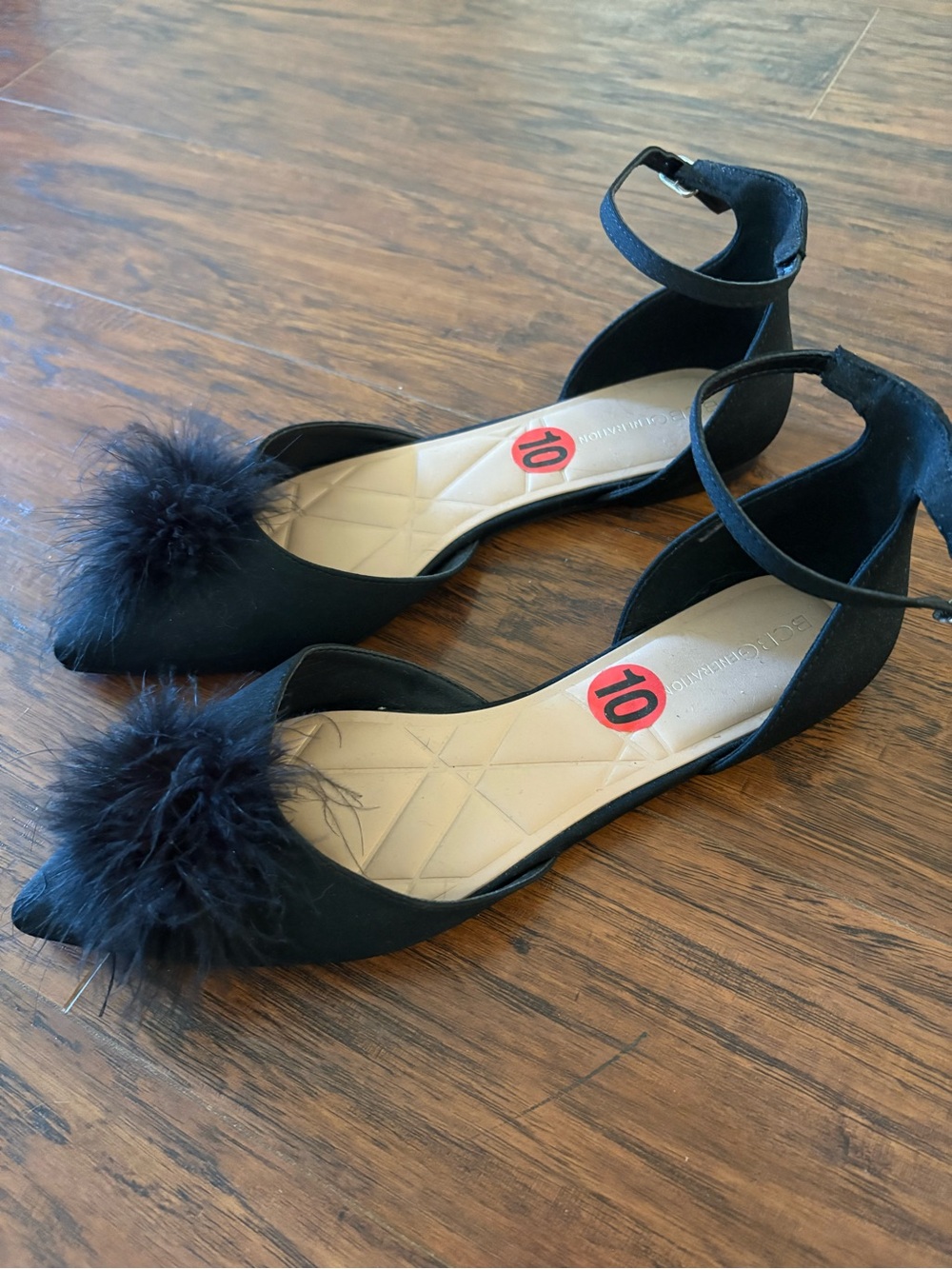 BCBGeneration Black Feather Pom Pointed Ankle-Strap Flats